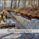 Block Retaining Wall- in progress- Contractor creating a block wall