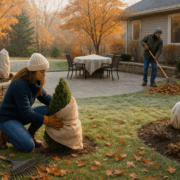 Minnesota backyard in late fall with mulched garden beds, wrapped shrubs, and landscape preparations for winter.